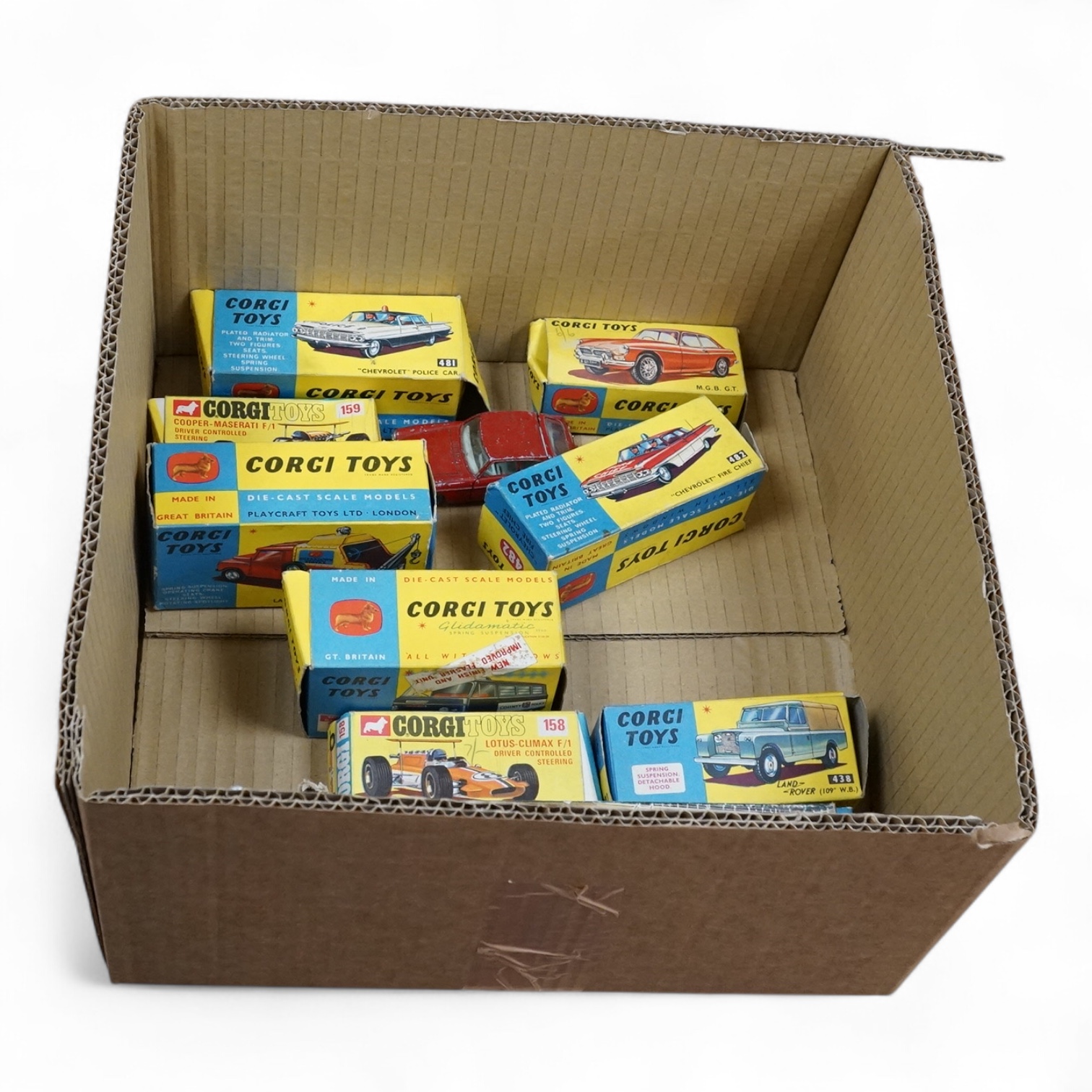 Nine boxed Corgi Toys; Land Rover with Ferrari Racing Car on Trailer (GS No.17), Land Rover (438), Lotus-Climax F1 (158), Cooper-Maserati F1 (159), Chevrolet Fire Chief’s car (482), Chevrolet Police Car (481), MGB GT (32
